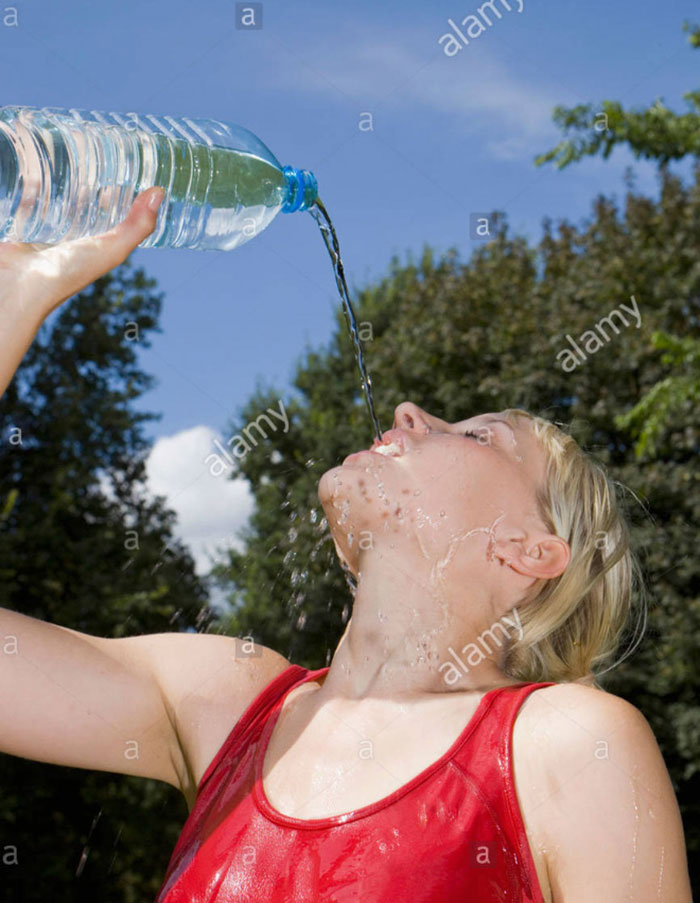 Women-Dont-Know-How-To-Drink-Water-Stock-Photos