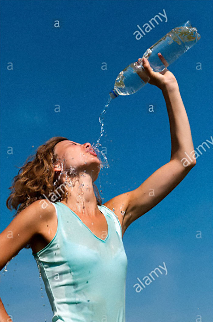 Women-Dont-Know-How-To-Drink-Water-Stock-Photos