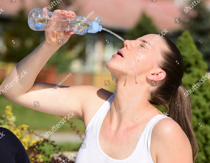 Women-Dont-Know-How-To-Drink-Water-Stock-Photos