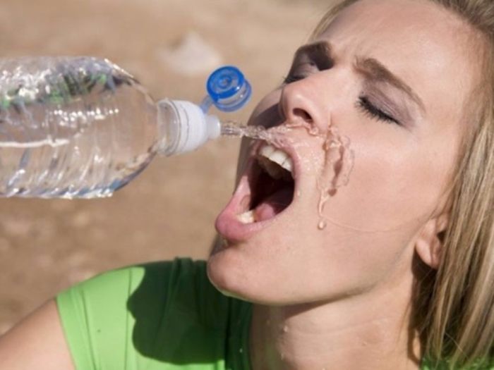 Women-Dont-Know-How-To-Drink-Water-Stock-Photos