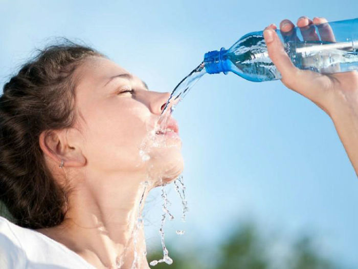 Women-Dont-Know-How-To-Drink-Water-Stock-Photos