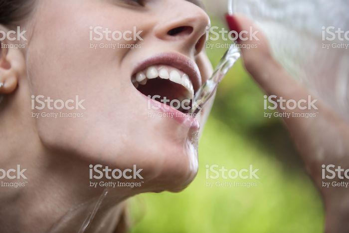 Women-Dont-Know-How-To-Drink-Water-Stock-Photos
