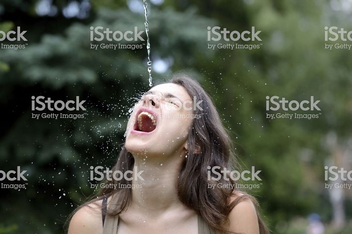 Women-Dont-Know-How-To-Drink-Water-Stock-Photos