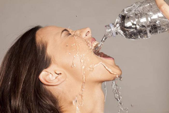 Women-Dont-Know-How-To-Drink-Water-Stock-Photos