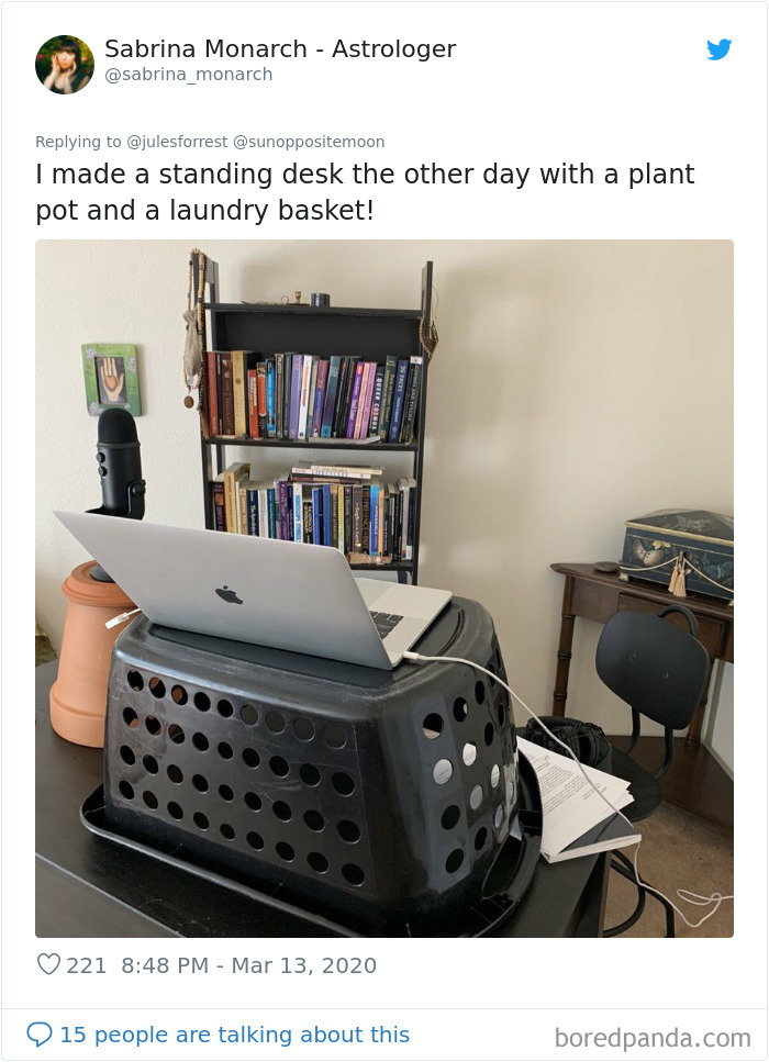  improvised standing desk with laptop on laundry basket showing reality of working from home setups