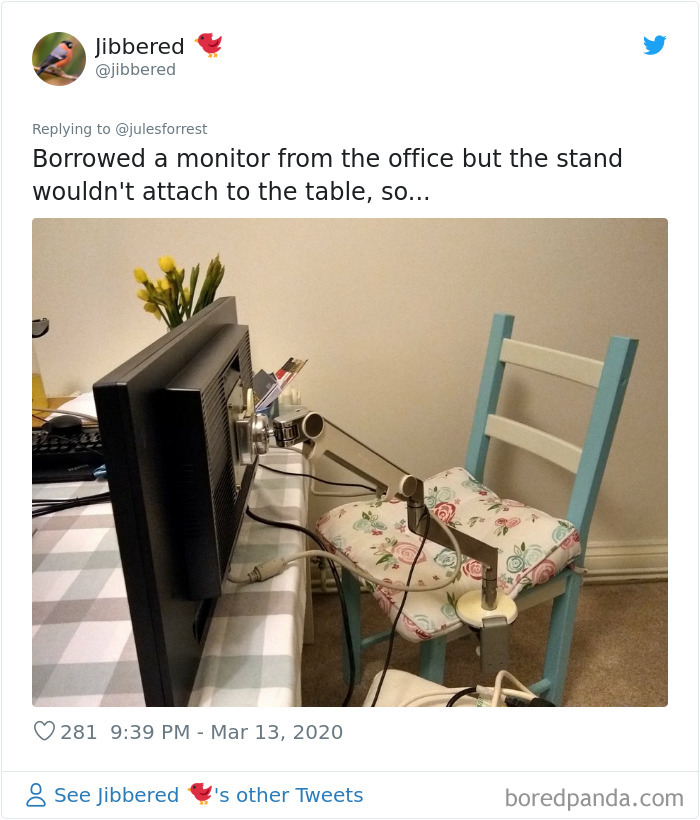 Work from home setup with monitor mounted on a chair using a clamp arm, showing reality of working from home spaces.