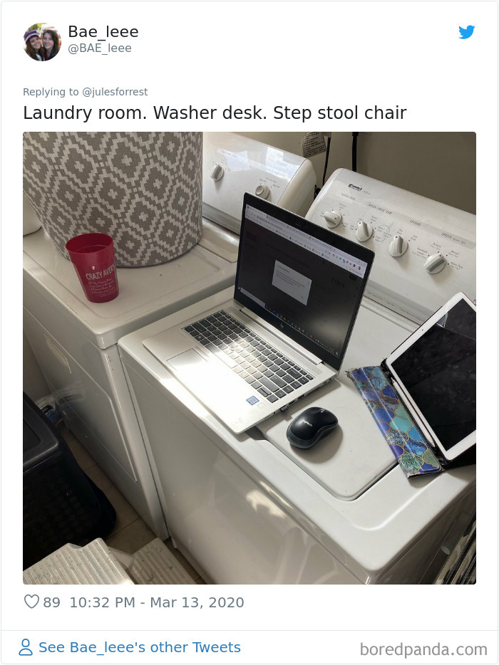 Laundry room workspace setup with laptop and tablet on washer, showing the reality of working from home without glamorous setups.