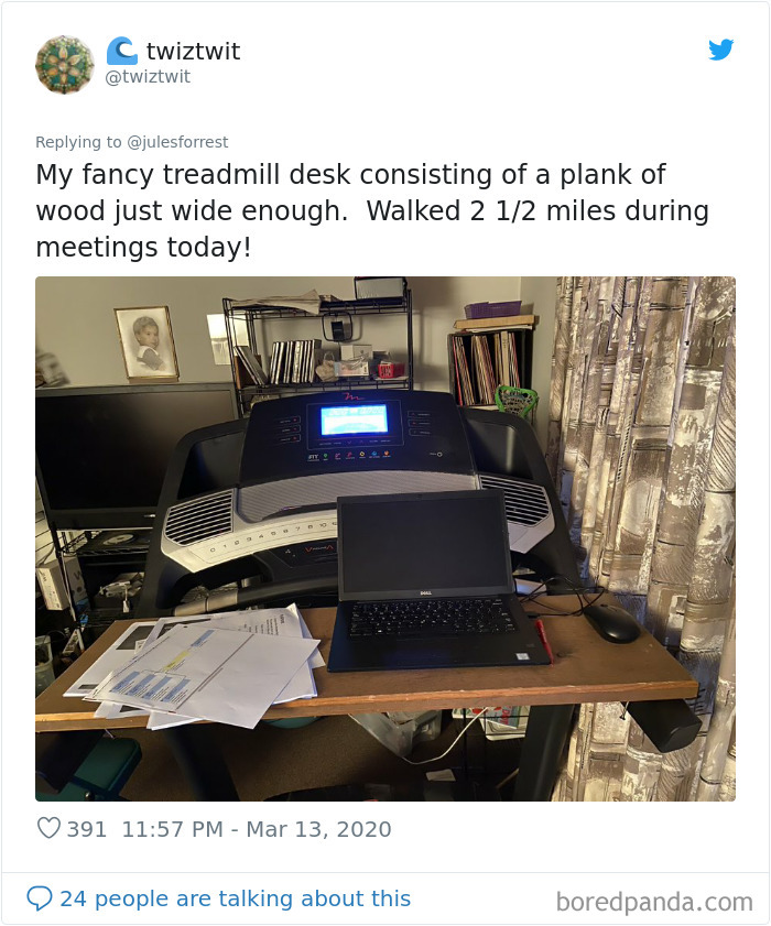 Treadmill desk setup with a wooden plank, laptop, and papers showing a realistic work from home workspace.