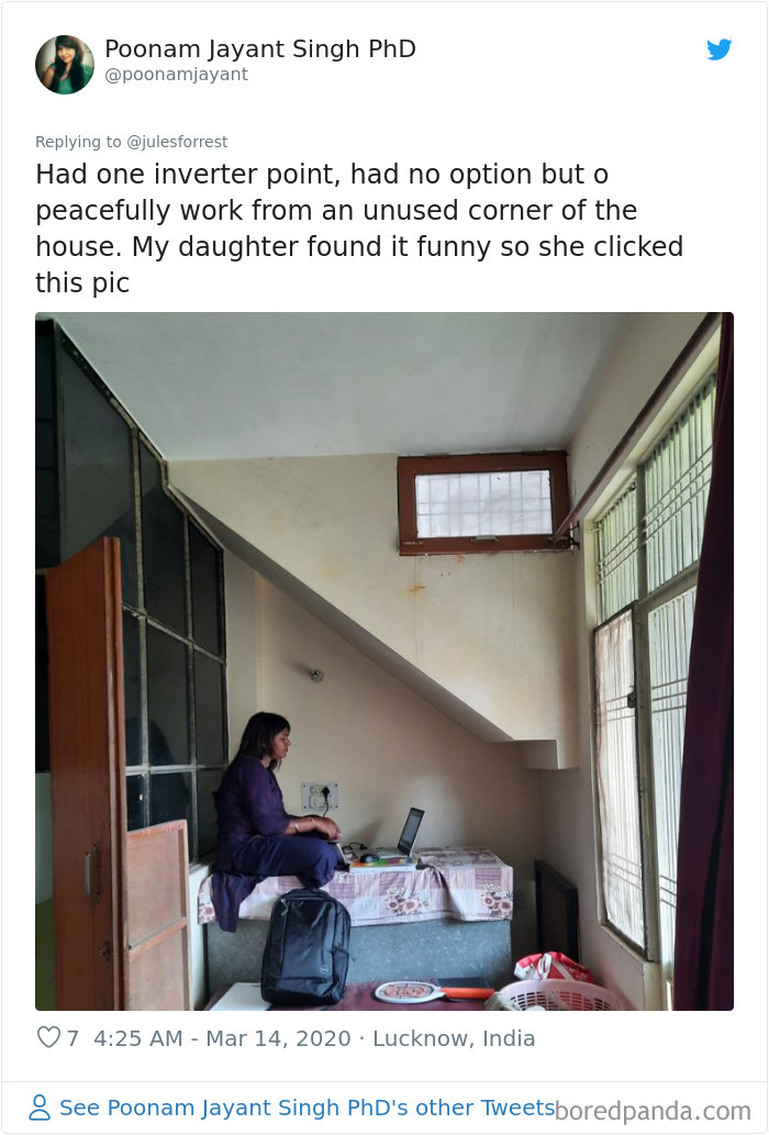 Woman working from home in a small, unused corner under stairs showing the reality of remote workspace setups.