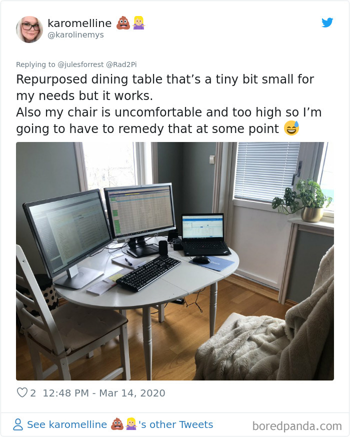 Home workspace with repurposed dining table, dual monitors, laptop, and an uncomfortable chair showing real work from home setup.