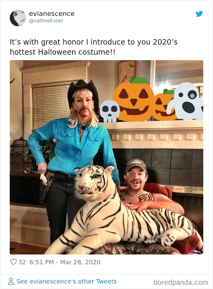 Two people in a Tiger King-inspired Halloween costume with a plush tiger, one wearing a cowboy hat and blue shirt.
