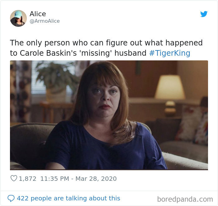 A woman with red hair sits on a couch in a dimly lit room, part of a meme inspired by Tiger King.