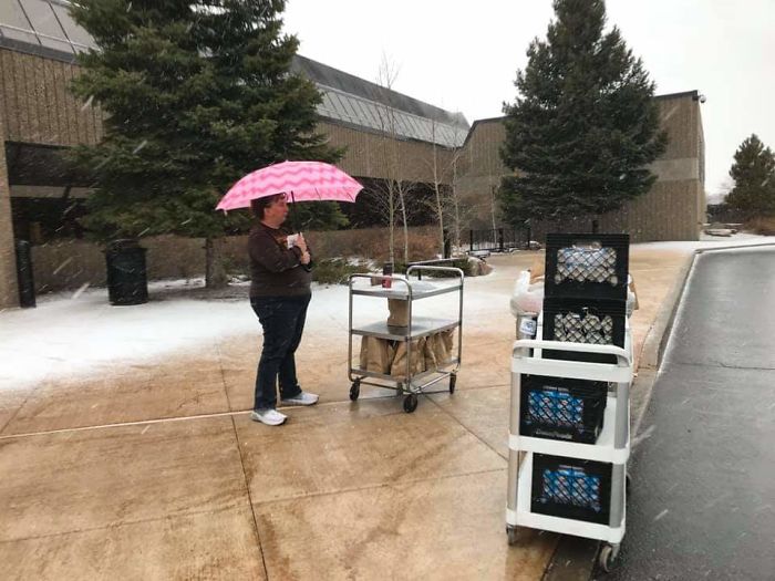 School Staff In Wyoming, Standing Out In The Storm With Lunches For Students