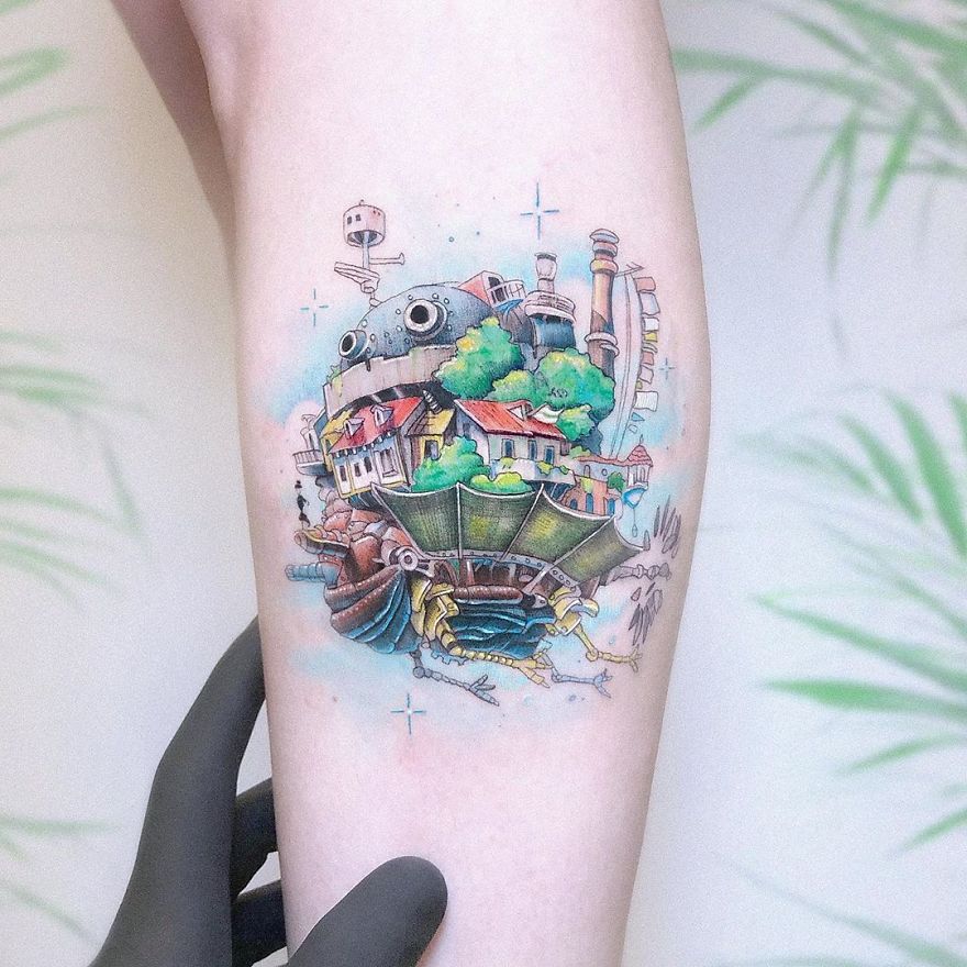Colorful micro tattoo by Eden Kozokaro, resembling a mini pop culture painting on a forearm.
