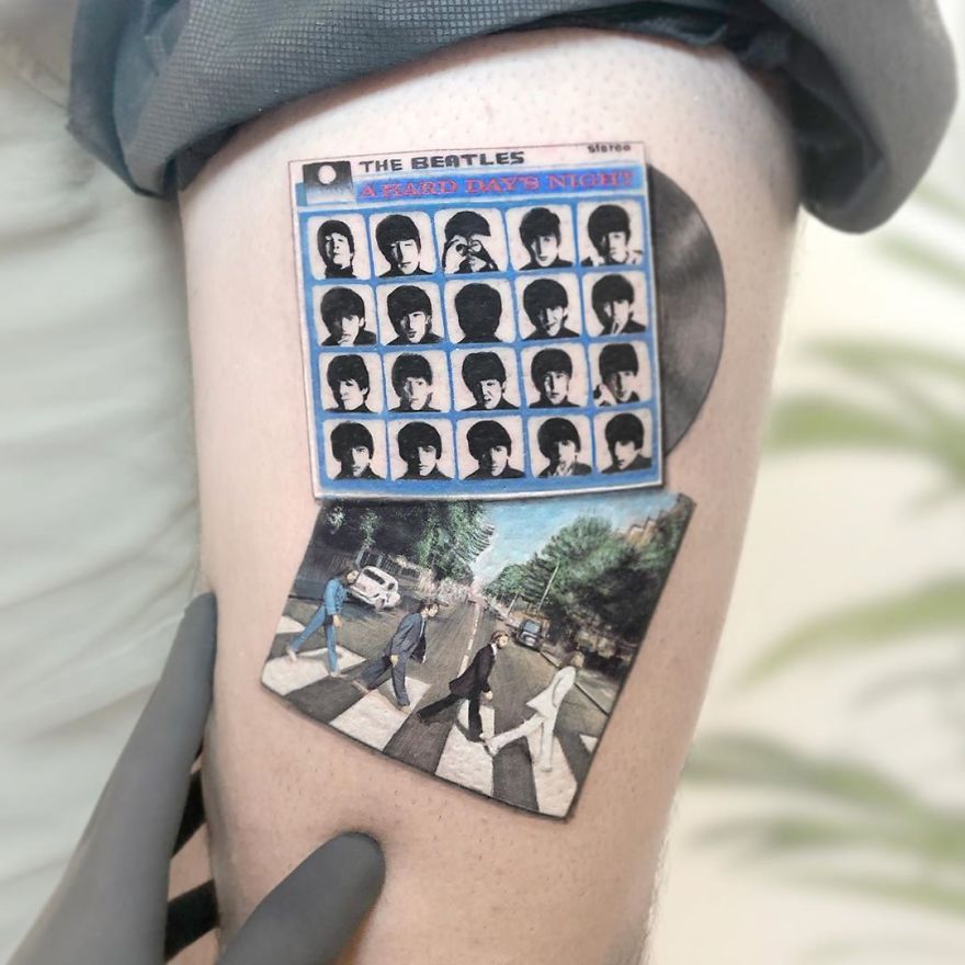 Colorful micro tattoos of iconic band album covers on skin, showcasing mini pop culture paintings.