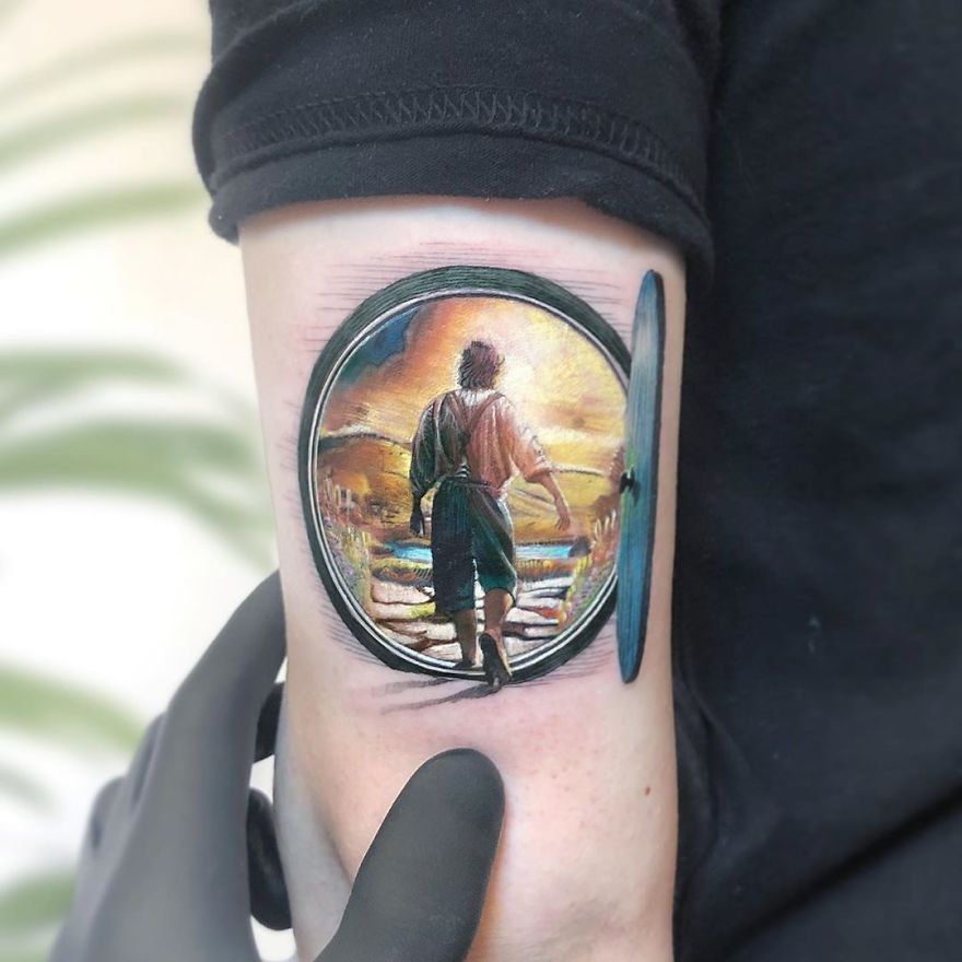 Colorful micro tattoo by Eden Kozokaro, depicting a vibrant pop culture scene on someone's arm.