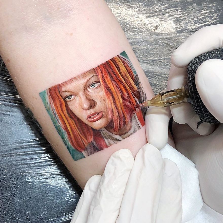 Colorful micro tattoo by Eden Kozokaro depicting a detailed portrait being created on the skin.