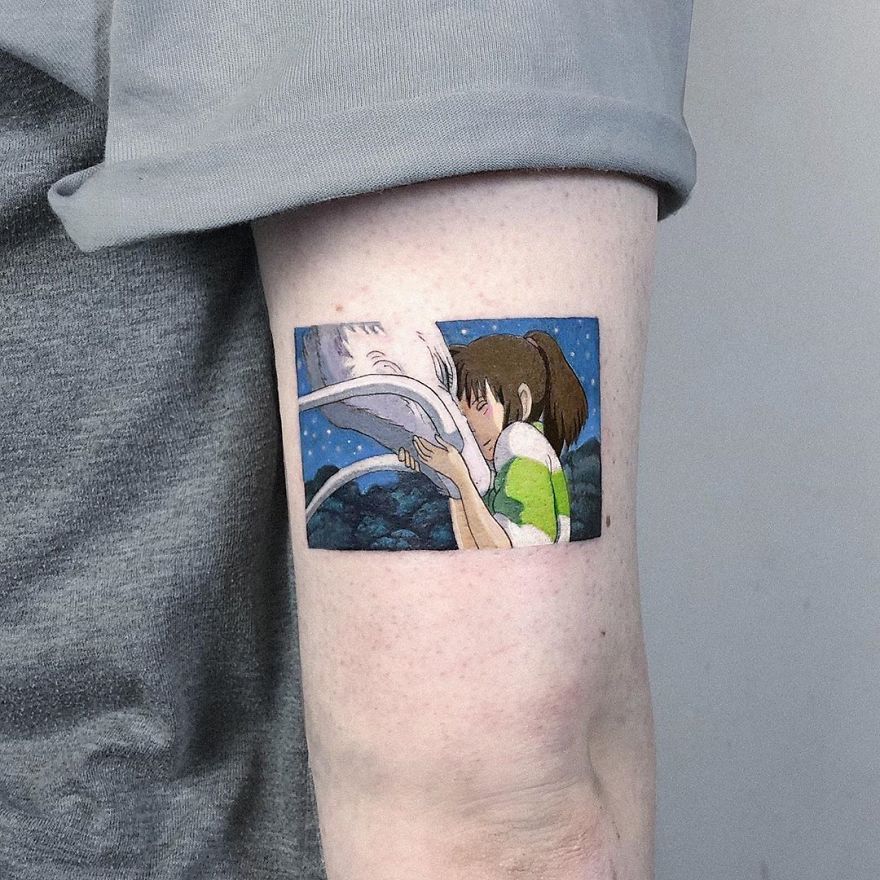 A colorful micro tattoo on an arm, depicting a pop culture scene with vivid detail.