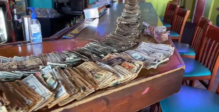 Bar Owner Removes $3,714 Worth Of Bills Stapled To The Walls To Pay Unemployed Staff