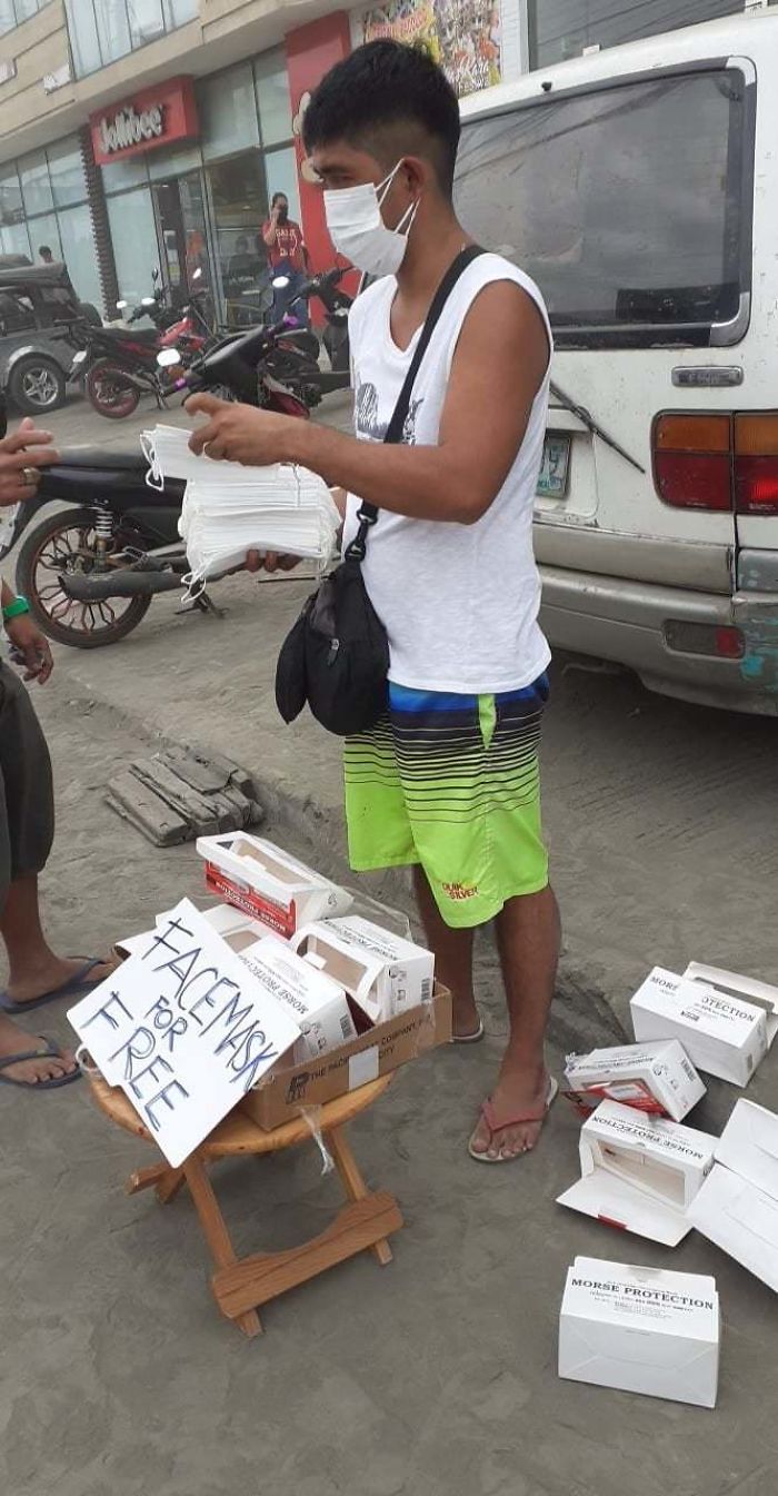 A Good Samaritan Giving Away Face Masks Due To The Ashfall In The Philippines