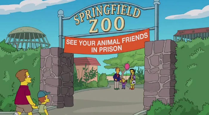 Springfield Zoo entrance with a witty sign saying see your animal friends in prison, from The Simpsons.