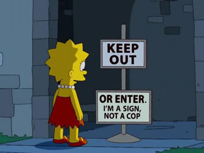Lisa Simpson standing near a witty Keep Out sign that reads I'm a sign, not a cop from The Simpsons.