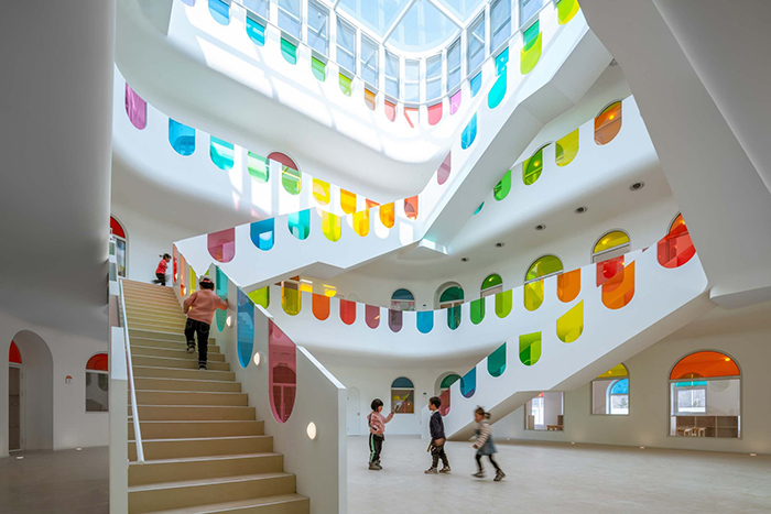 483 Rainbow-Colored Glass Panels Emit A Rotating Kaleidoscope In This Playful Kindergarten