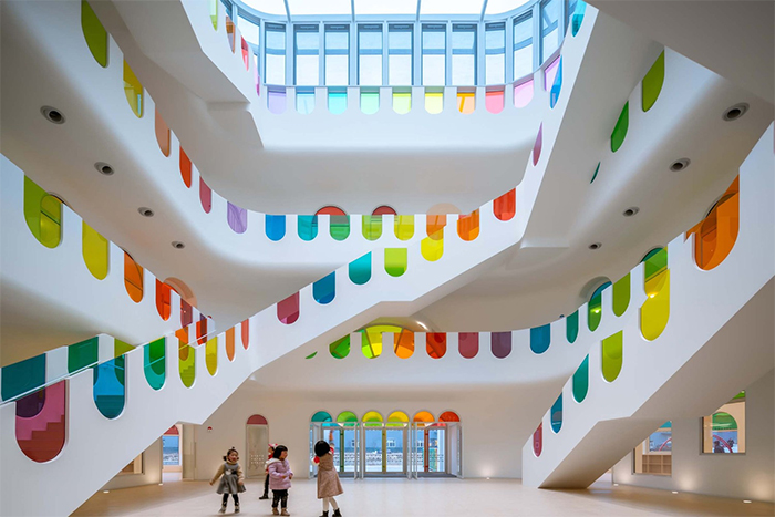 483 Rainbow-Colored Glass Panels Emit A Rotating Kaleidoscope In This Playful Kindergarten