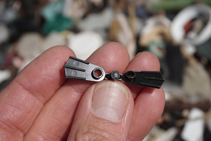 Man Takes Home 551lbs Of Trash From The Beach, Sorts It Out In His Backyard And Shares Interesting Finds