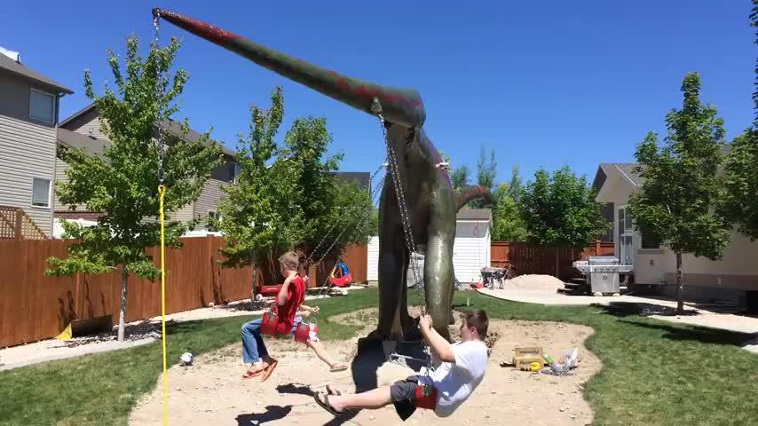 This Dad Should Win An Award For Building An Incredible 14-Meter Dinosaur Jungle Gym For His Kids