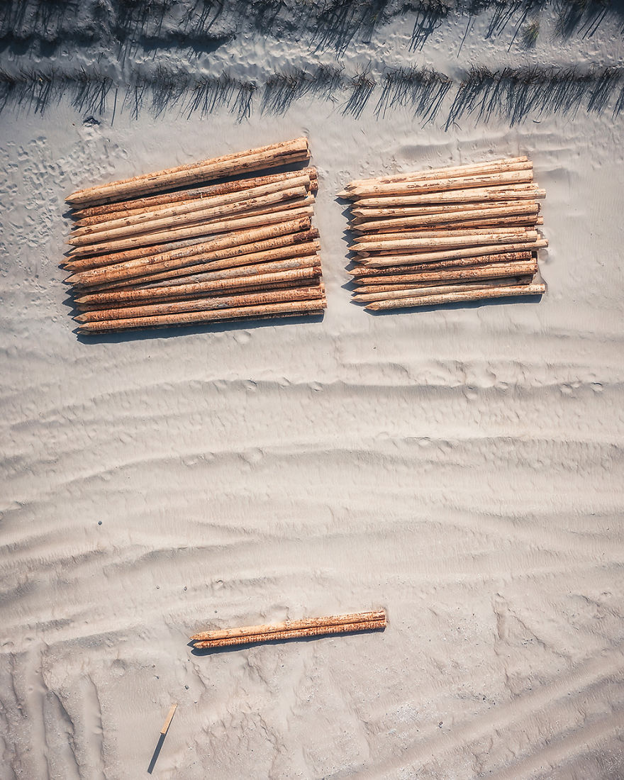 Breakwater Piles On A Beach (Poland)