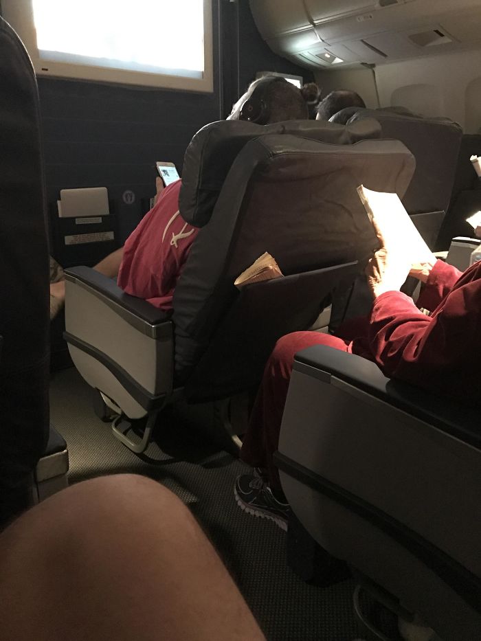 Got Bumped To First Class (Super Sweet) Only To Witness This Lady Tearing Off The Pages Of The Book She's Reading