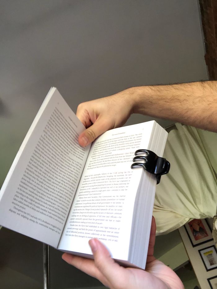 Using A Hair Clip To Hold The Side Of A Book When Reading On An Angle Or Laying Down To Prevent "Page Flopping"