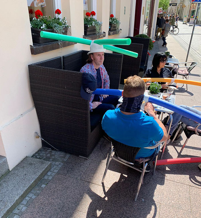 Cafe In Germany Gives Customers Hats With Pool Noodles To Keep Them Apart Cafe In Germany Gives Customers Hats With Pool Noodles To Keep Them Apart