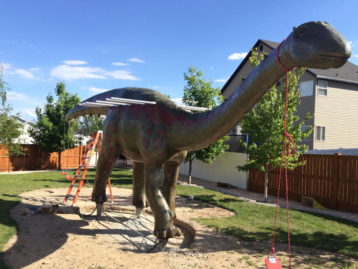 This Dad Should Win An Award For Building An Incredible 14-Meter Dinosaur Jungle Gym For His Kids
