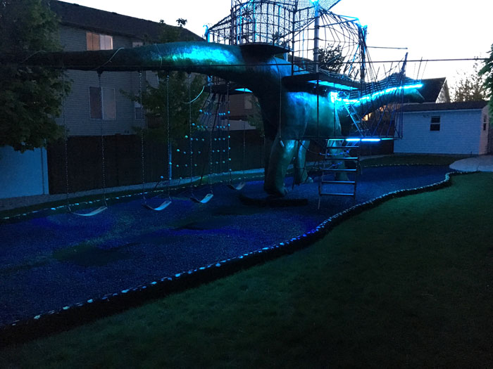 This Dad Should Win An Award For Building An Incredible 14-Meter Dinosaur Jungle Gym For His Kids