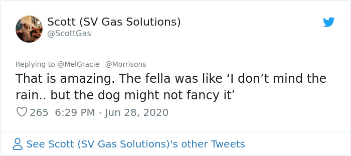 Security Guard For A Morrisons Store Goes Viral For Shielding A Waiting Dog From The Rain With His Umbrella