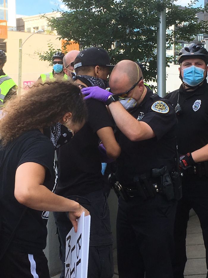Police Officer Hugging A Protester In Nasville