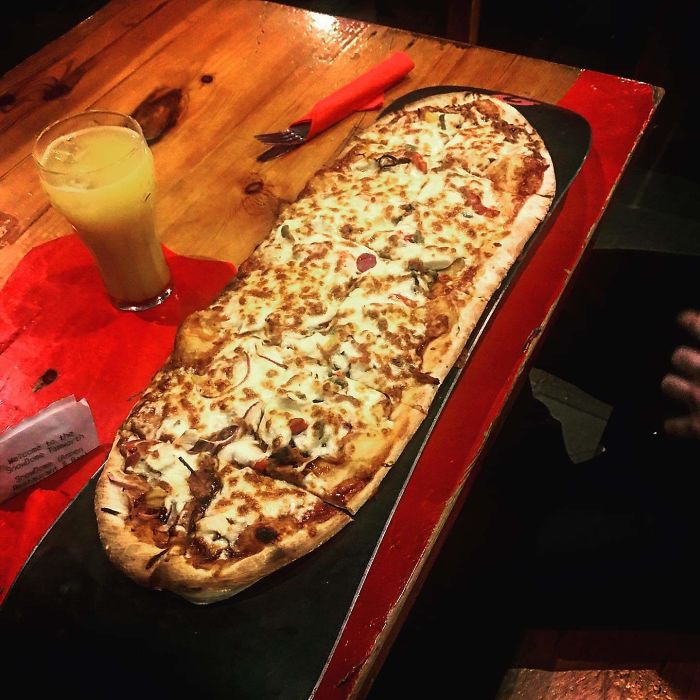 Indoor Snowboarding Place Cafe Serves Pizza On Real Snowboard