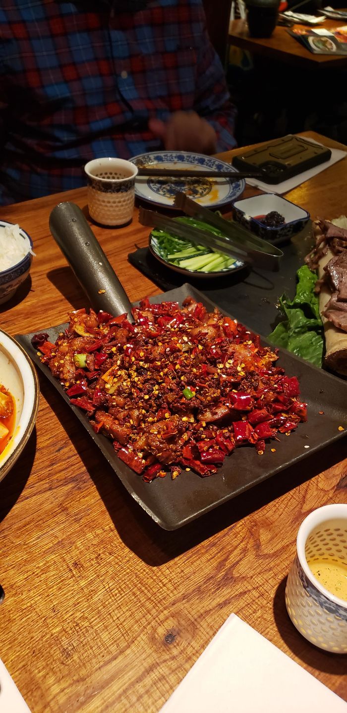 Digging For Chicken In A Shovel Full Of Peppers