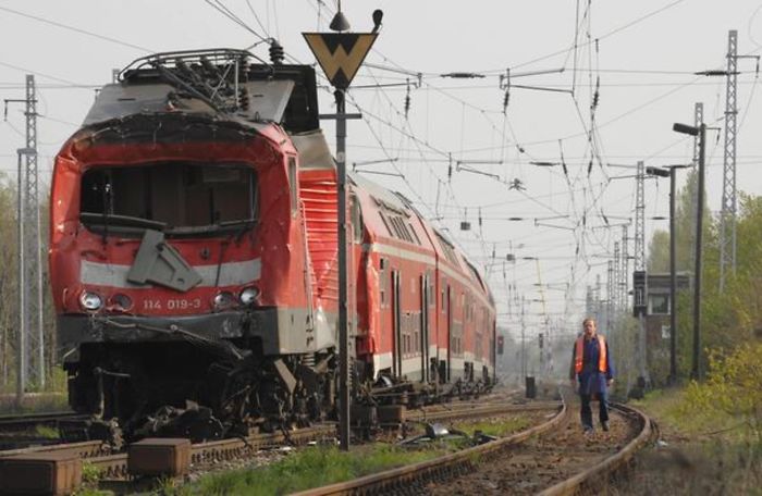 A Regional Passenger Train After Hitting A Liquid Gas Train. You Can See The Buckled Roof. The Tanker Car Hit Was Essentially Undamaged. No One Died.