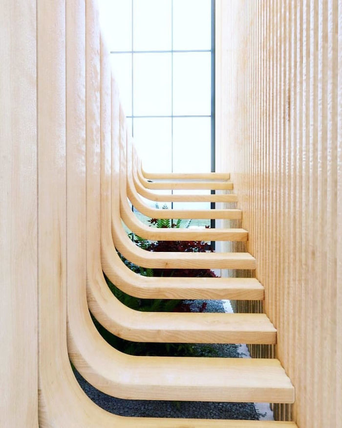 This Minimalistic Staircase Resembles A Strand Of DNA Inside Of A Two-Story Home