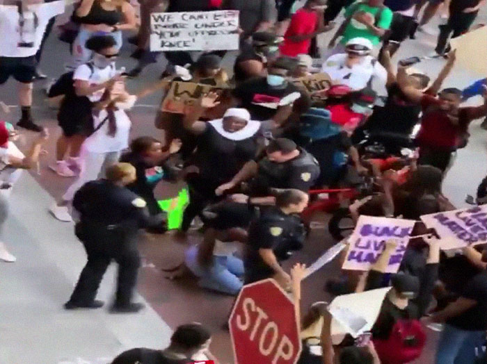 After A Cop Pushed A Kneeling Woman, Black Female Police Officer Stands Up For Her