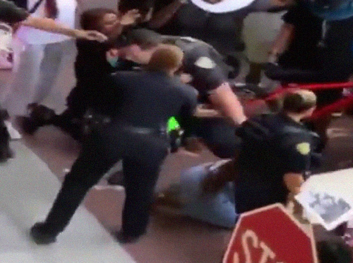 After A Cop Pushed A Kneeling Woman, Black Female Police Officer Stands Up For Her After A Cop Pushed A Kneeling Woman, Black Female Police Officer Stands Up For Her