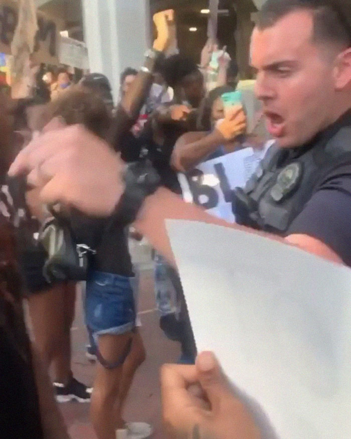 After A Cop Pushed A Kneeling Woman, Black Female Police Officer Stands Up For Her After A Cop Pushed A Kneeling Woman, Black Female Police Officer Stands Up For Her