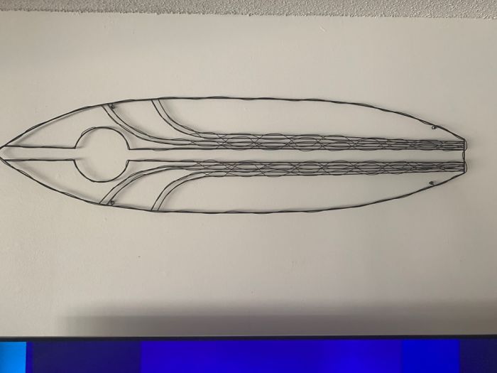 A Wall Hanging/Surfboard Made Out Of Old Hangers. Found It In An Antique Store