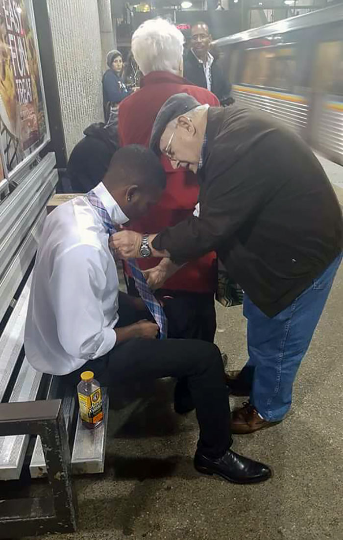 Older Gentleman Teaches Young Guy How To Tie His Tie