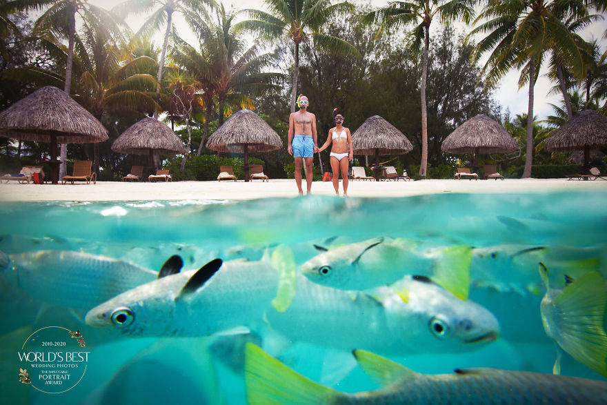This Colorful, Goofy, Lovable Photo Of A Couple On A Beach In Bora Bora.