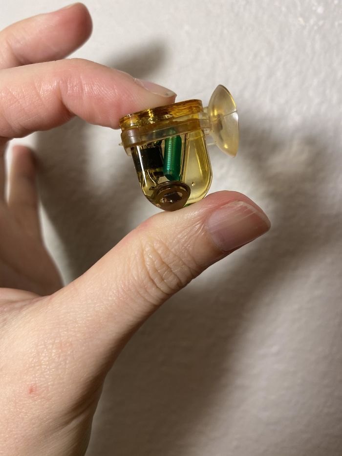 Weird Gadget In Epoxy With Suction Cup Hidden In Tiny Fake Book. My Boyfriend Doesn’t Remember Where It Came From. Does Anybody Recognize This?