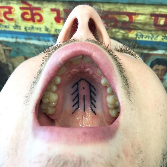 Tattoo on the roof of the mouth, showcasing an unconventional canvas by a skilled tattoo artist.